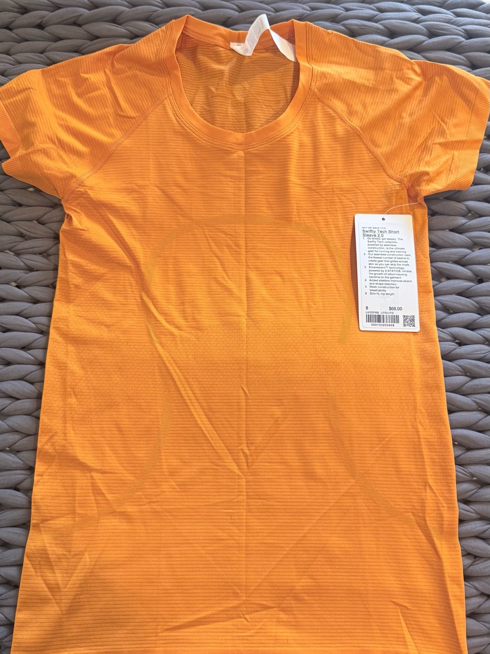 Lululemon Swiftly Tech short sleeve. Hip length. NWT. Lit Orange. Size 8